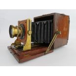 A Moore and Co unusual mahogany box bellows camera.