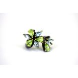 A 925 silver ring set with marquise cut blue topaz and pear cut peridots, (O.5).