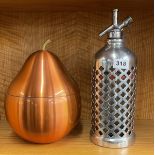A vintage chromium plated soda syphon cover with a copper finished ice bucket.