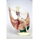 An original Art Deco German porcelain figurine of a young woman dancing, H. 25cm.