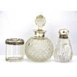 Three hallmarked silver topped cut glass dressing table items, tallest H. 12cm.