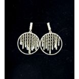 A pair of silver drop earrings set with 0.3ct of diamonds.