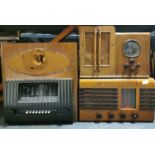 A wooden cased Radio Acoustic Products (R.A.P) valve radio, with a wooden cased Portadyne model