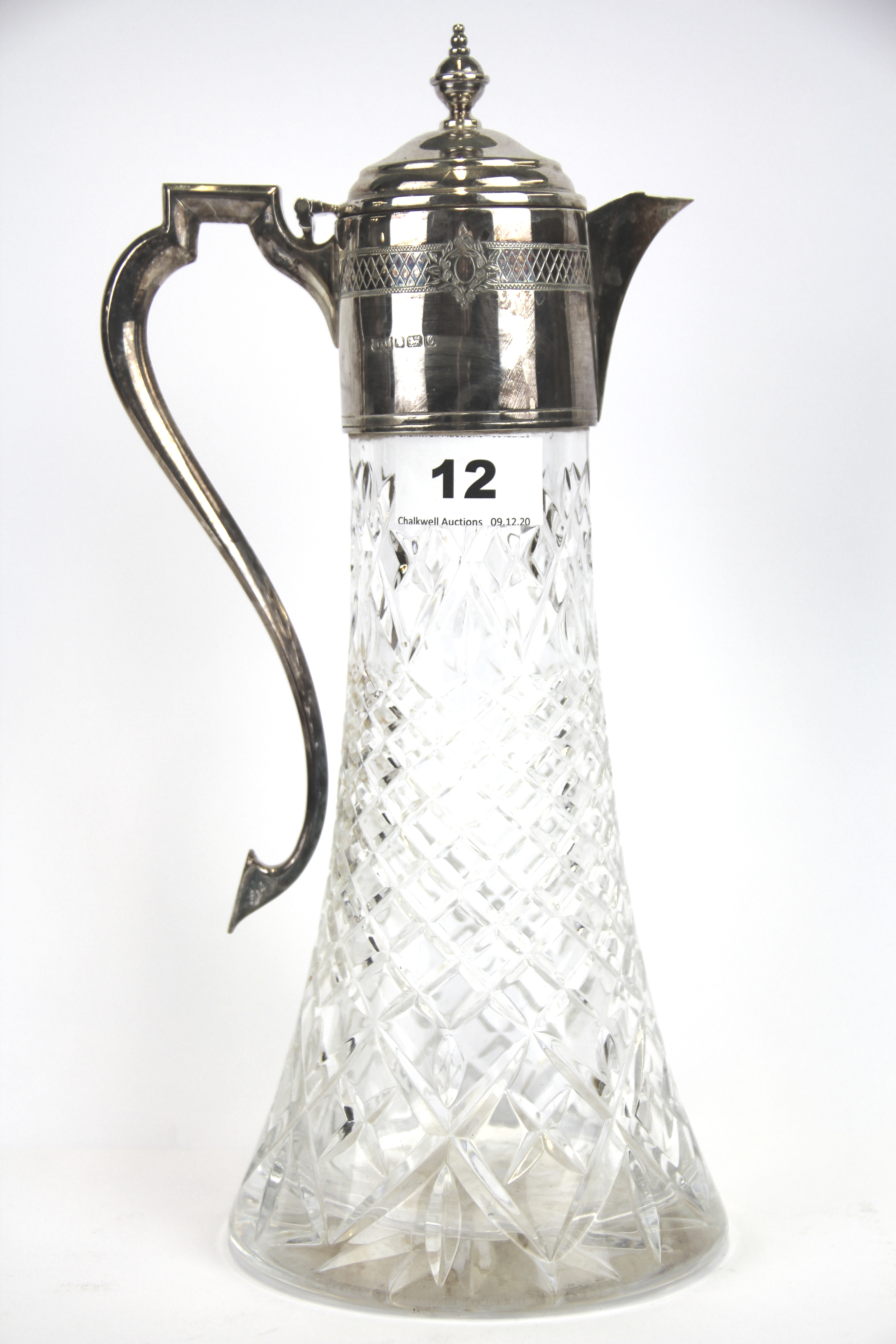 A hallmarked silver mounted cut glass claret jug, H. 31cm.
