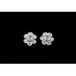 A pair of 18ct white gold (stamped 750) diamond set cluster earrings set with brilliant cut