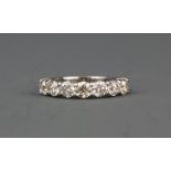 An 18ct white gold ring set with seven brilliant cut diamonds, approx. 2.18ct overall, (N.5).