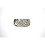 A 9ct white gold diamond pave set ring, (O).