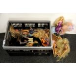 A box of Barbie and other dolls.