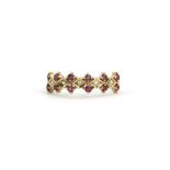 A 9ct yellow gold ruby and diamond set ring, (O).