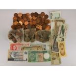 A quantity of mixed coins and bank notes.
