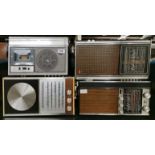 A Panasonic portable radio and cassette player and three further portable radios.
