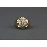 A 14ct yellow gold diamond set cluster ring, (P).