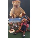 A Golden mohair Teddy Bear, together with a contemporary Pinocchio puppet,