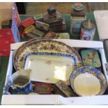 A collection of decorative advertising tins and other ceramic items,