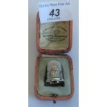 A 1911 Coronation silver thimble (boxed).