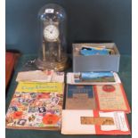 A gilt brass vintage German rotating ball anniversary clock under glass dome,