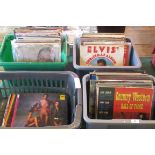 Four boxes containing approximately 100 vinyl LP's to include: Elvis Presley, Shirley Bassey,