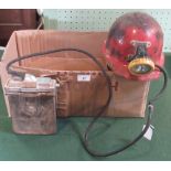 A mid-20th century miners electric lamp, together with a 1950's miner's helmet.