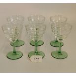 A set of 1920's clear and green stemmed decorative wine glasses.