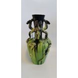 A large circa 1900 lime green and manganese glazed Art Pottery vase, of Oriental design,