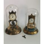 A vintage gilt brass German rotating ball anniversary torsion clock,