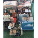 A collection of nine miniature sewing machines, to include model by Vulcan and Singer (2 boxed),