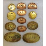 Twelve London North Eastern Railway and Great Western Railway, copper and brass pay cheque tags.