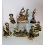 A collection of seven Capodimonte bisque porcelain figure groups, to include: lovers at the Well,