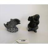 Two Inuit carved stone figures of an Inuit male and a leaping salmon, initialled WEG.