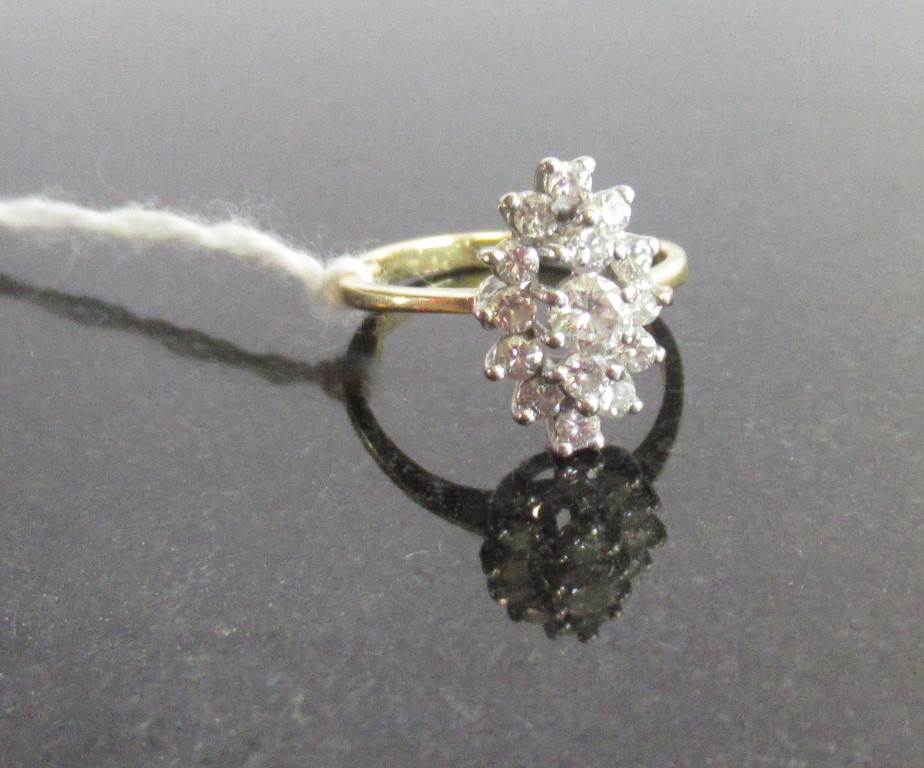 A marquise-shaped diamond cluster ring, the principle brilliant cut diamond ,