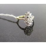 A marquise-shaped diamond cluster ring, the principle brilliant cut diamond ,