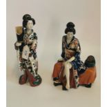 A pair of Japanese glazed pottery figures (AF).