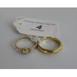 A single stone gypsy set diamond ring, and a three stone half hoop diamond ring, gross weight 5.