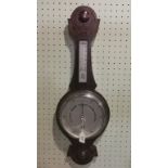 A late Edwardian oak cased aneroid barometer.