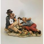 A large Capodimonte bisque porcelain figure group of a vagrant encampment, signed by the artist,