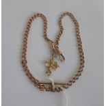 A 9ct rose gold curb pattern watch chain, with single clip connections and T bar,