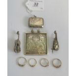 Four gem set rings, a silver vesta case,