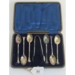 A cased set of six shell pattern spoons and associated sugar tongs Sheffield 1892/3.