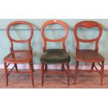 A collection of three beech wood balloon back side chairs.