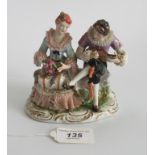 A small porcelain figural group, depicting a seated lady and gentleman,