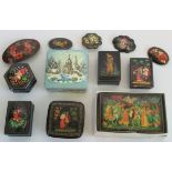 A collection of six Russian lacquer work boxes and five brooches of similar design,