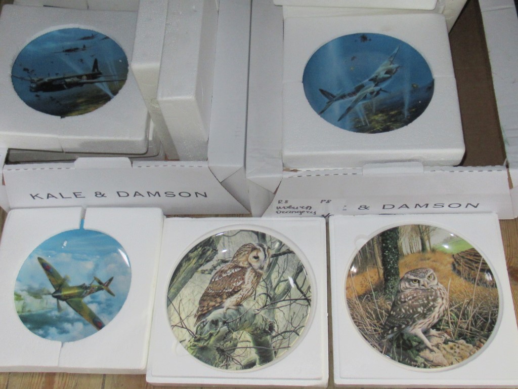 Two boxes of decorative collectors plates, depicting aircraft of the Royal Air Force,