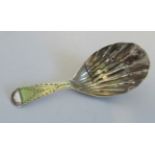 A silver George III caddy spoon, the engrave handle with vacant cartouche(AF).