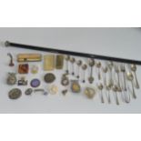A silver topped evening cane, together with an assorted quantity of badges, silver spoons,