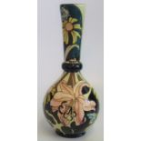 A tall Black Rydon hard pattern vase, decorated in the floral manner by K.