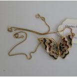 An enamel butterfly pendant, the open wo