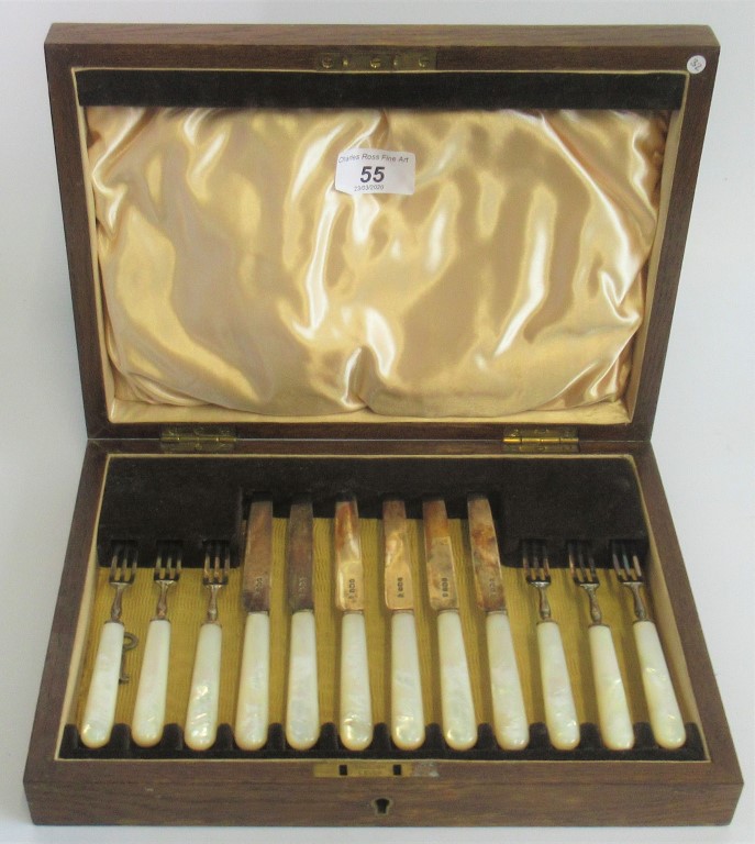 A cased set of hallmarked silver fruit knives and fork's with mother of pearl effect handles,