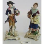 A pair of Continental porcelain figures, depicting a lady and gentleman in period dress (AF).