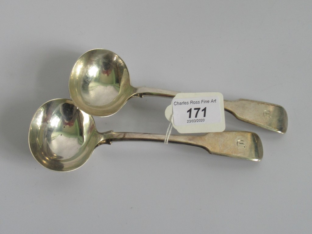 A pair of hallmarked silver soup ladles, London 1851/2.