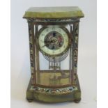 A late 19th century gilt bronze and onyx bow front eight day mantle clock,